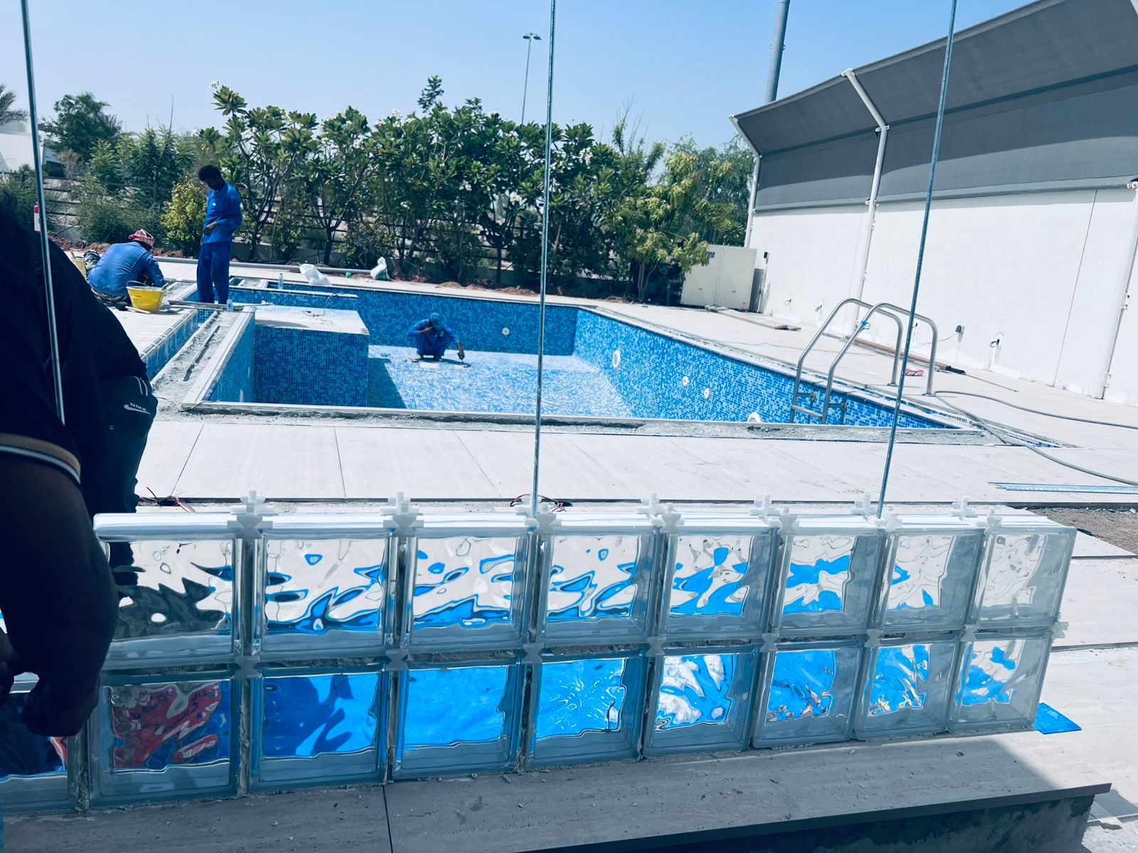 Curved glass block pool wall